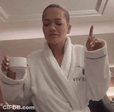 Woman In White Robe Saying Vivel GIF