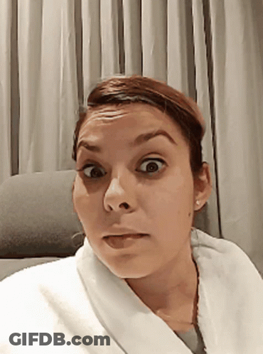 Woman In White Robe Surprised GIF