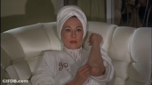 Woman In White Robe With Letter J GIF