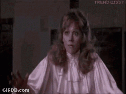 Woman In White Satin Blouse Making Funny Face GIF