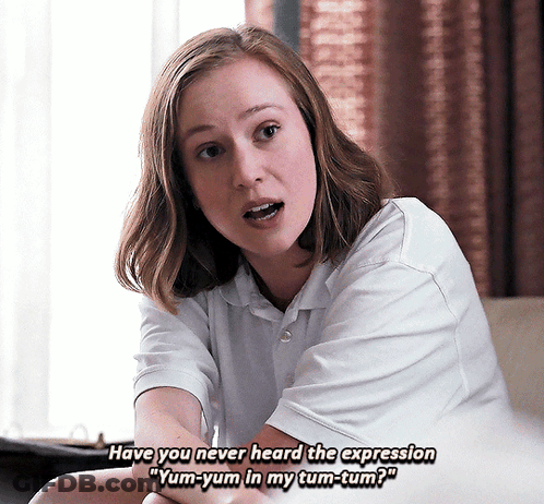 Woman In White Saying Yum-Yum In My Tum-Tum GIF