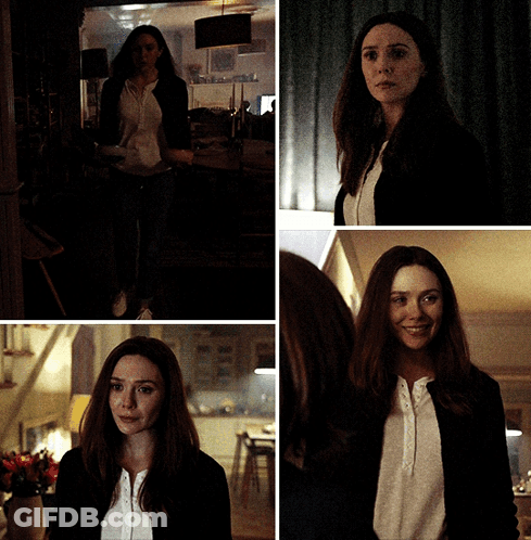 Woman In White Shirt And Black Jacket Smiling GIF