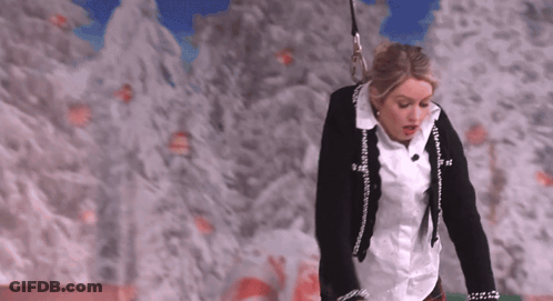 Woman In White Shirt And Black Jacket With Chanel Logo GIF