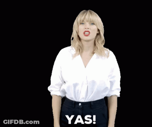 Woman In White Shirt And Black Pants Saying Yas GIF