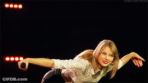 Woman In White Shirt And Black Shorts Holding Microphone GIF