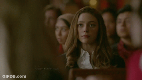 Woman In White Shirt And Black Sweater Brett Matthews GIF