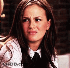 Woman In White Shirt And Black Tie Making Funny Face GIF