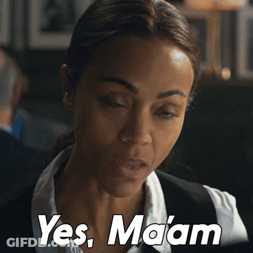 Woman In White Shirt And Black Vest Says Yes Maam GIF