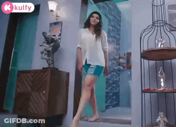 Woman In White Shirt And Blue Shorts Walking GIF