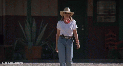 Woman In White Shirt And Cowboy Hat Walking GIF