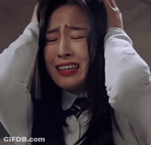 Woman In White Shirt And Tie Crying Covering Ears GIF