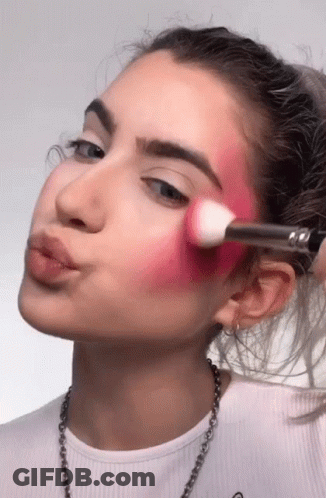 Woman In White Shirt Applying Makeup GIF