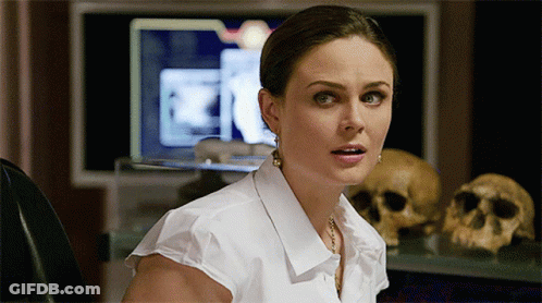 Woman In White Shirt At Computer GIF