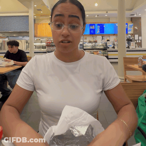 Woman In White Shirt At Ice Cream Menu GIF
