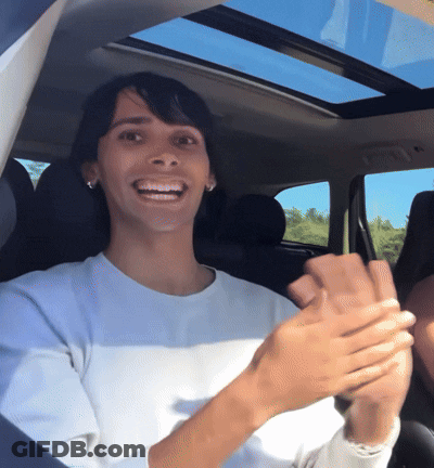 Woman In White Shirt Clapping In Car GIF
