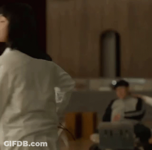 Woman In White Shirt Dancing At Microphone GIF