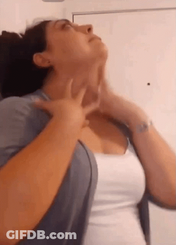 Woman In White Shirt Holding Neck GIF