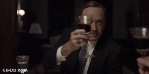 Woman In White Shirt Holding Wine Glass GIF