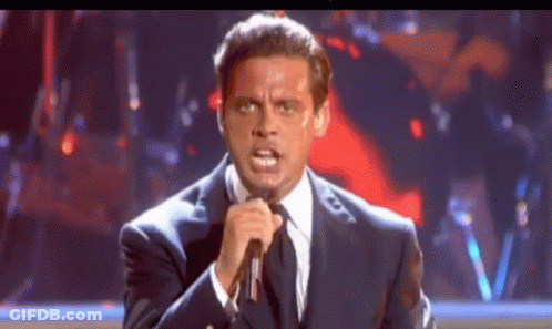 Woman In White Shirt In Front Of Crowd And Talent Sign GIF