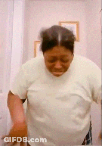 Woman In White Shirt In Front Of Mirror GIF