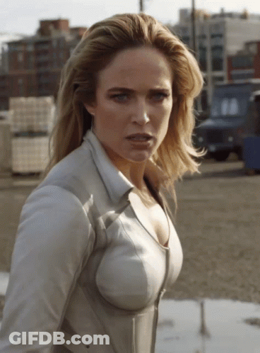 Woman In White Shirt Looking At Camera GIF