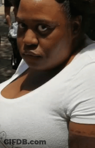 Woman In White Shirt Looking At Camera GIF