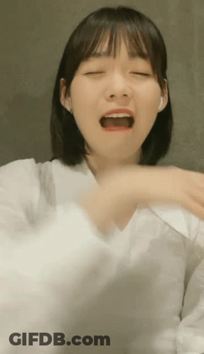 Woman In White Shirt Making Funny Face GIF