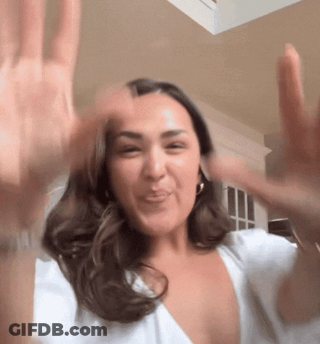 Woman In White Shirt Making Funny Face GIF