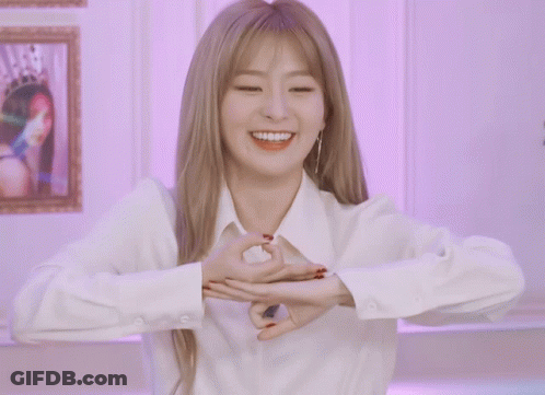 Woman In White Shirt Making Hand Heart GIF