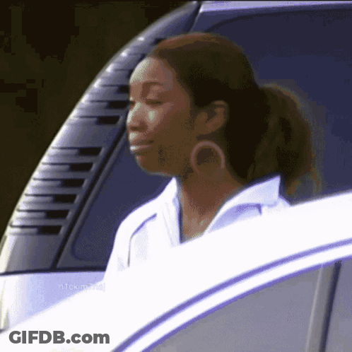 Woman In White Shirt Sitting In Car GIF