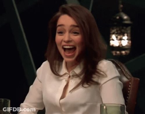 Woman In White Shirt Sitting With Mouth Open GIF