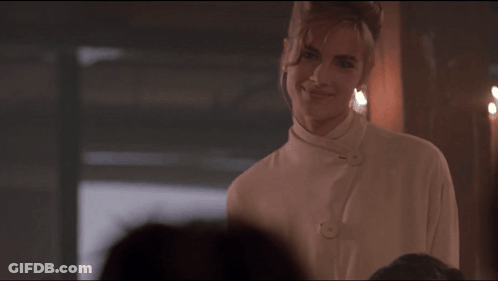 Woman In White Shirt Smiling In Front Of Group GIF