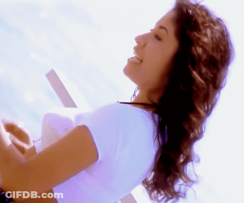 Woman In White Shirt Smiling Looking Aside GIF