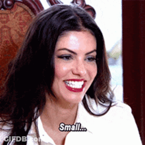 Woman In White Shirt Smiling Saying Small GIF