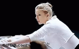 Woman In White Shirt Stretching Arms GIF