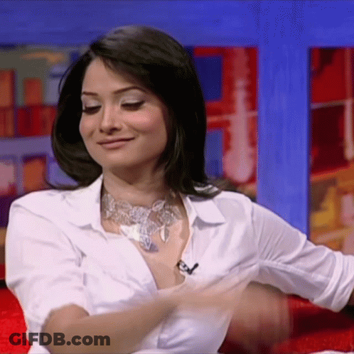 Woman In White Shirt Taking Off Shirt GIF