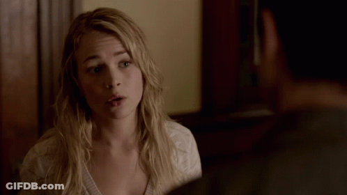 Woman In White Shirt Talking To Man In Grey Shirt GIF