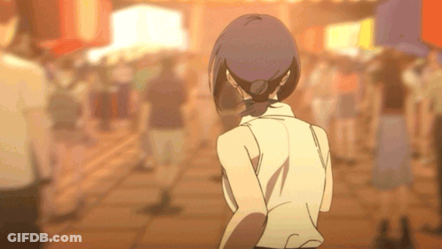 Woman In White Shirt Walking In Crowded Street GIF