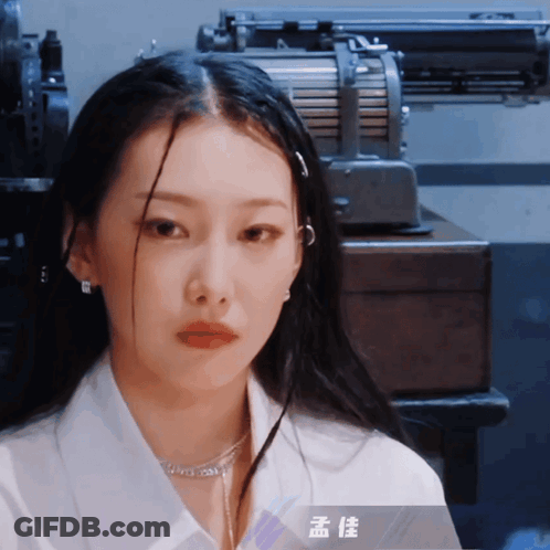 Woman In White Shirt With Chinese Writing Necklace GIF