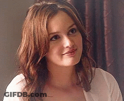 Woman In White Shirt With Long Brown Hair Smiling GIF
