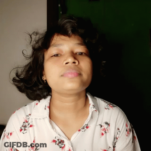 Woman In White Shirt With Red Flowers GIF