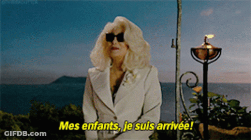 Woman In White Suit And Sunglasses Says Mes Enfants GIF