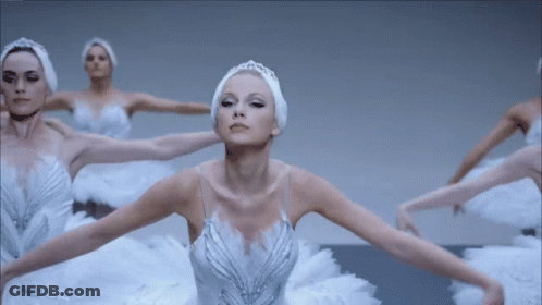 Woman In White Swan Dress Surrounded By Other Women GIF