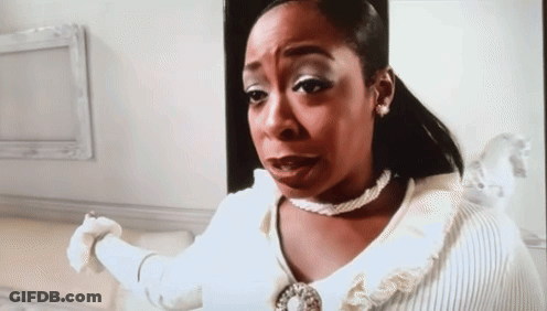 Woman In White Sweater And Pearl Necklace Making Funny Face GIF
