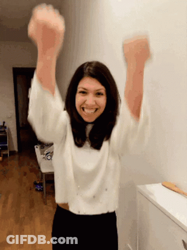 Woman In White Sweater Arms Up GIF