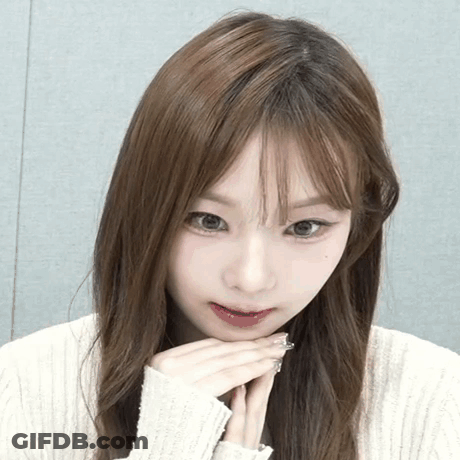 Woman In White Sweater Close Up GIF