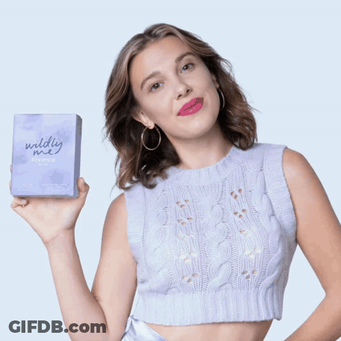 Woman In White Sweater Holding Bottle Of Florence GIF