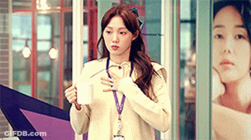 Woman In White Sweater Holding Coffee GIF