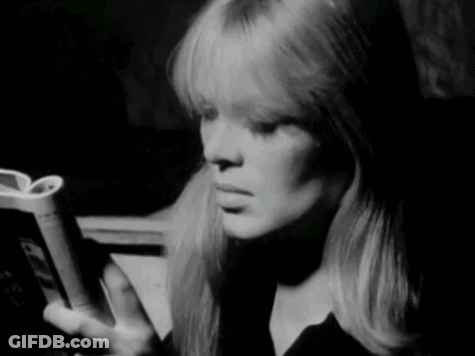 Woman In White Sweater Holding Prada Purse GIF