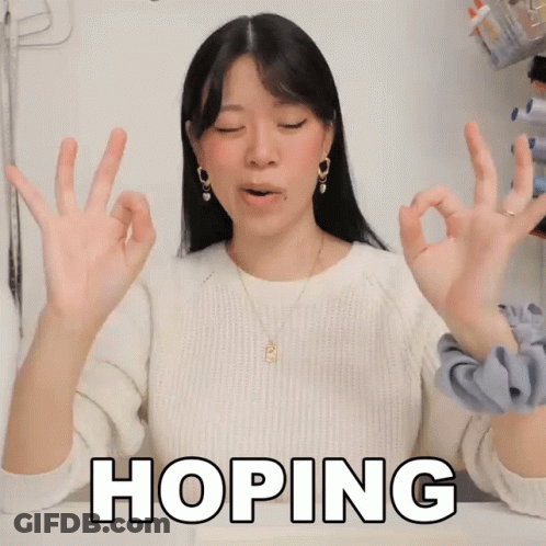 Woman In White Sweater Making OK Sign GIF